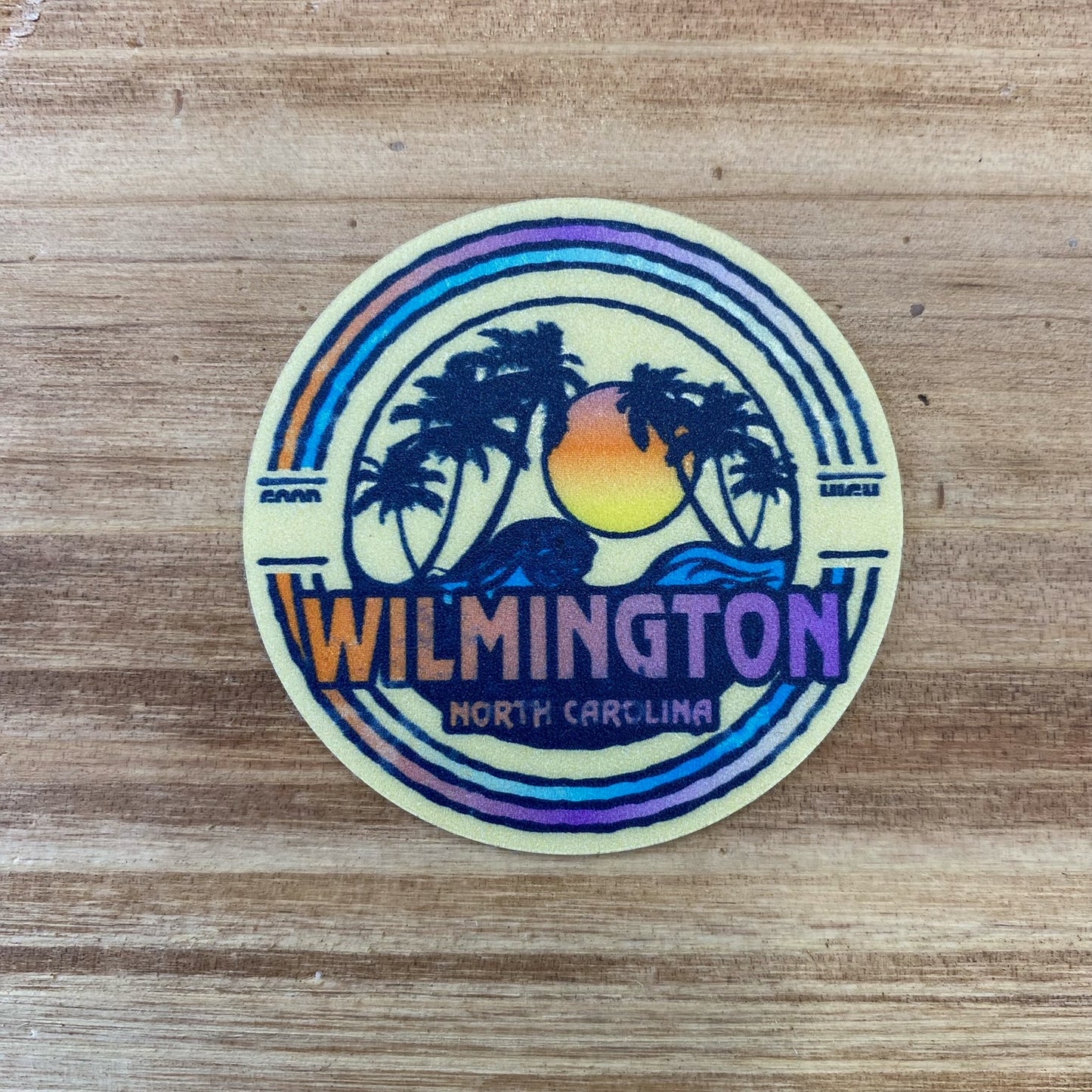 CIRCLE SUNSET WAVES WILMINGTON , NC – STICKER ( 2″ X 2″ ROUGHLY )